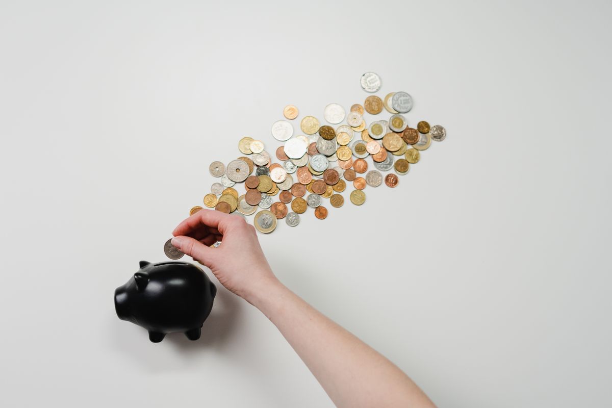 Coins being added to savings